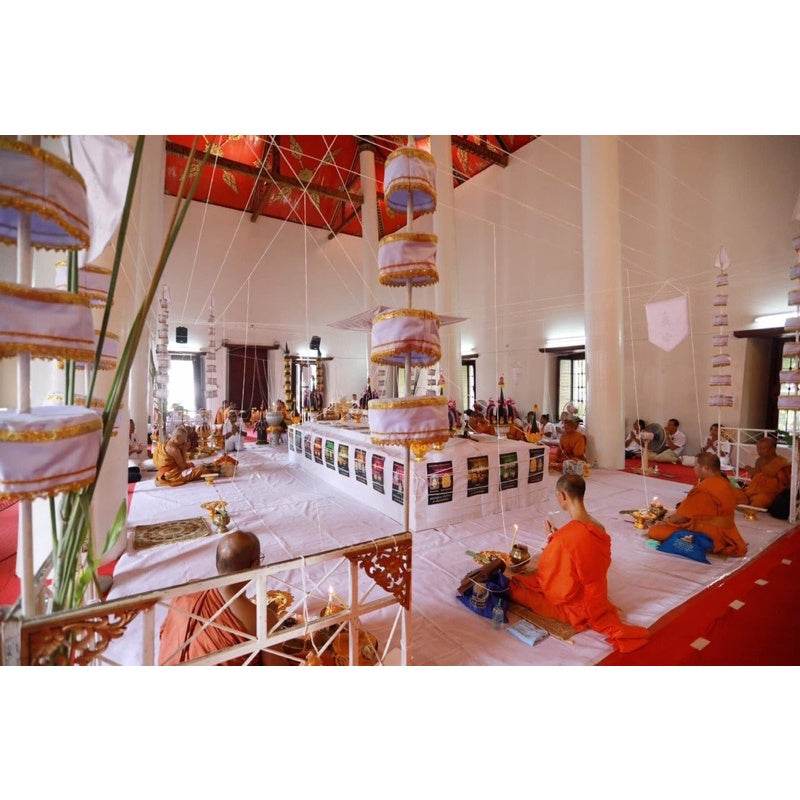 Billionaire Prosperity Thai amulet being blessed by Buddhist monks during a ceremonial temple ritual