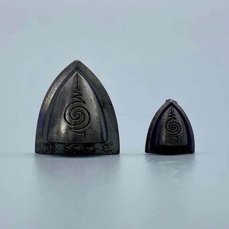 Phaan Thai luck amulet set black metal duo with engraved spiral yantra symbols for home protection