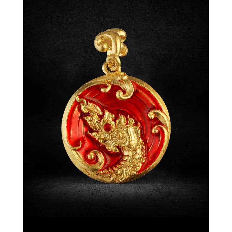 Gold and red round pendant with carved Naga serpent motif and enamel finish Naga treasure amulet Thailand