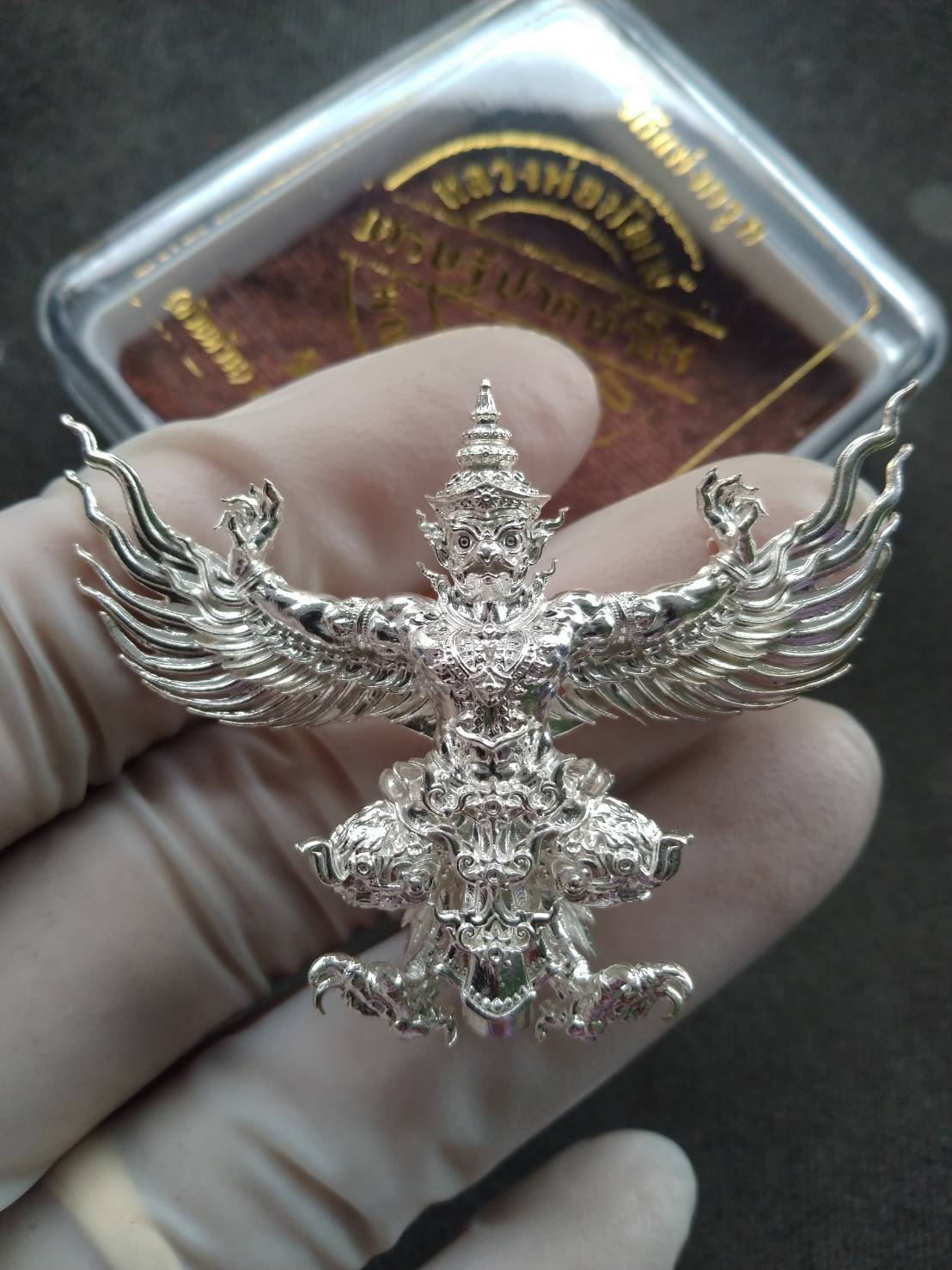 Thai Garuda Pak Nam Pho Tycoon edition silver Garuda pendant amulet with spread wings held in gloved hand
