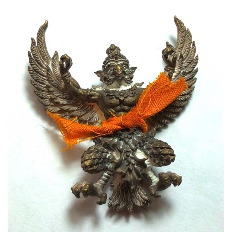Phaya Garuda amulet for sale with detailed metalwork and tied orange fabric from Thai Blessing Co