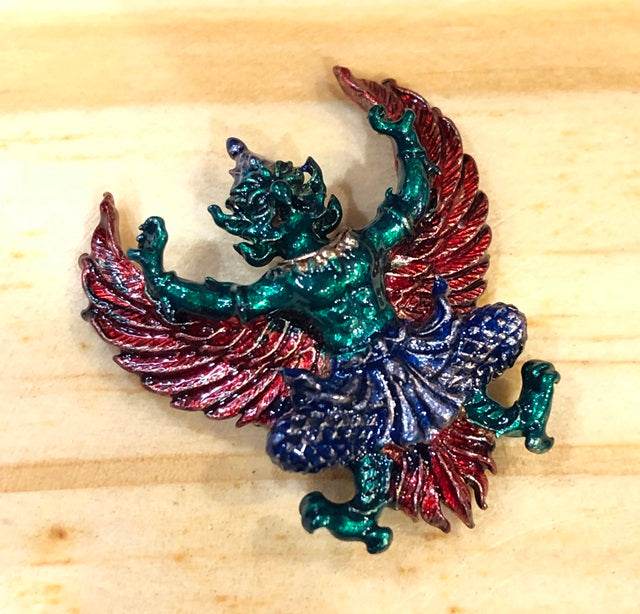 Colorful Phaya Krut amulet for protection, featuring a mythical creature with vibrant wings and intricate details
