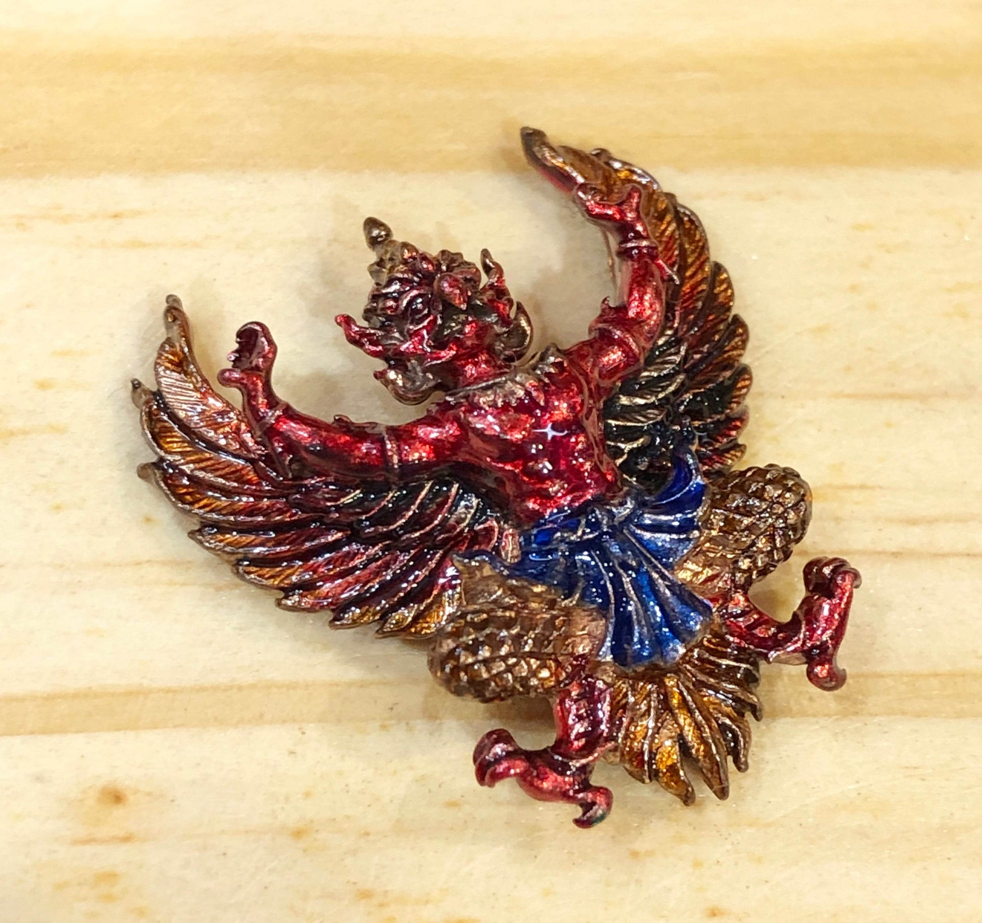Colorful Phaya Krut amulet for protection featuring elaborate detailing and vibrant colors