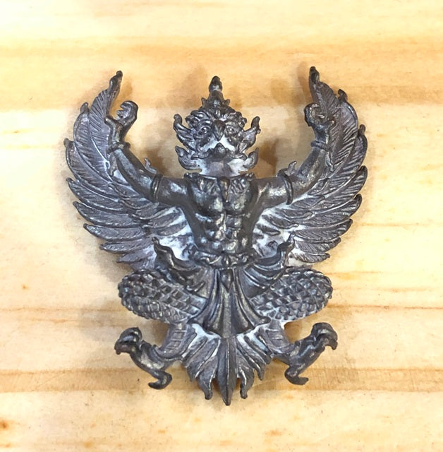 Phaya Krut amulet for wealth and protection crafted in detailed metal design