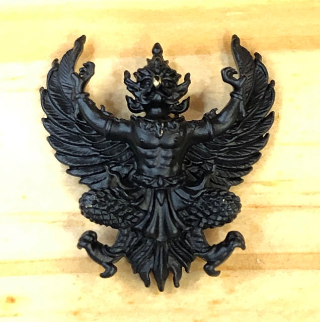Phaya Krut amulet for wealth and protection with intricate design featuring a powerful figure