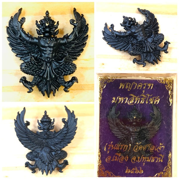Phaya Krut amulet for wealth and protection displayed in detailed black resin ornament design