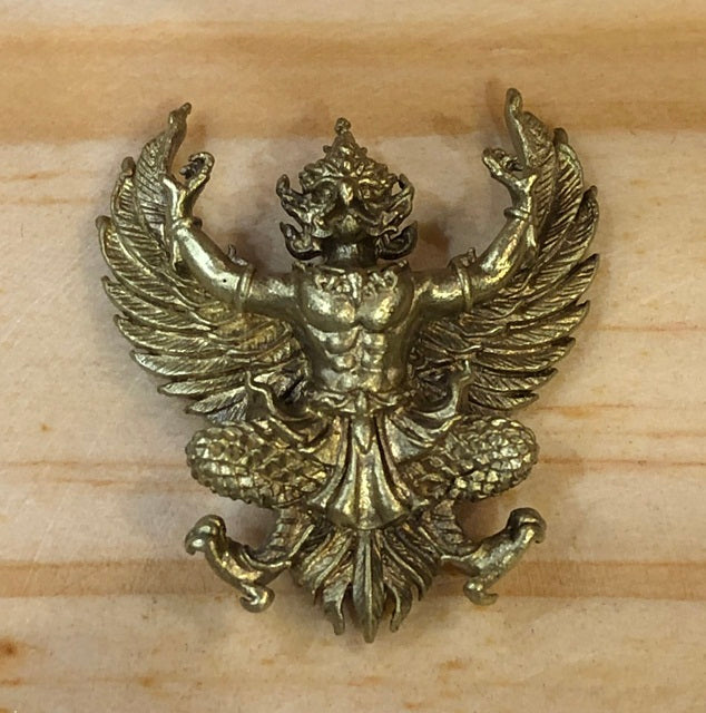 Phaya Krut amulet for wealth and protection with intricate design and winged figure