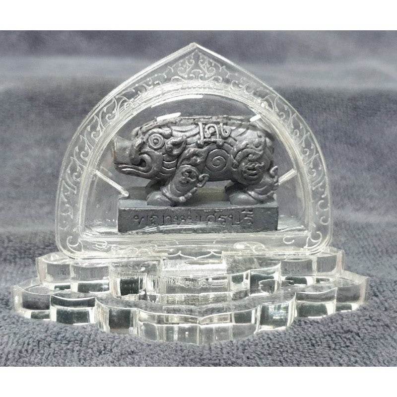 Phaya Moo Setthi sacred pig figurine displayed on a crystal base for good fortune in Feng Shui and religion