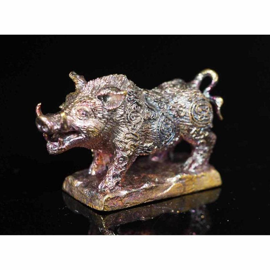 Intricate bronze Phaya Waraha Racha Chok power talisman shaped like a mythical boar on a base