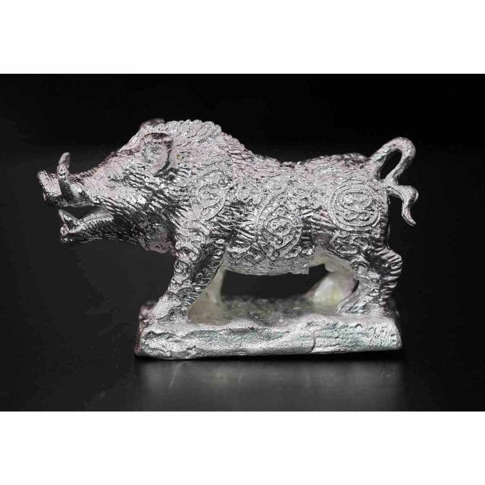 Silver metal boar figurine Phaya Waraha wealth charm with intricate engraved patterns