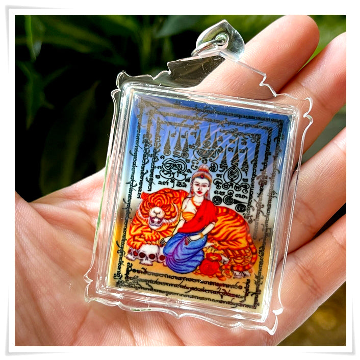 Phayak Naree tiger goddess amulet colorful rectangular pendant in clear casing showing goddess with tiger
