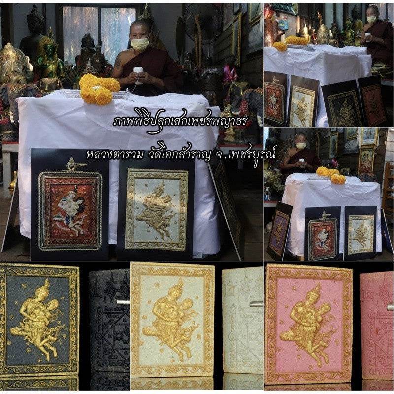 Phet Phaya Thon charm for attraction displayed on a table with ceremonial items and a monk