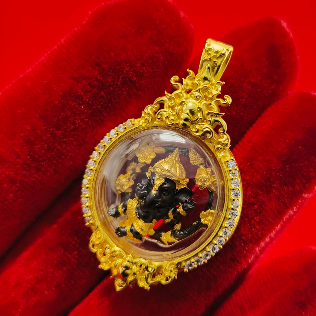 Gold Phra Brahma amulet for protection encased in a decorative pendant with intricate designs