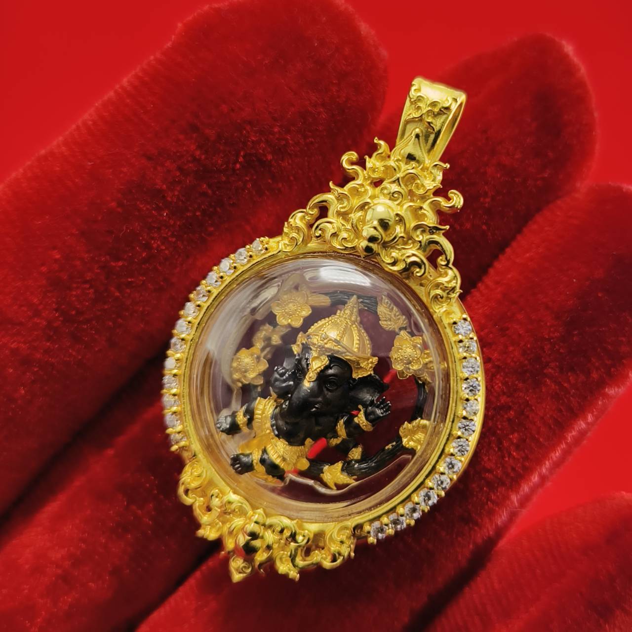Gold Phra Brahma amulet for protection encased in a decorative pendant with intricate designs