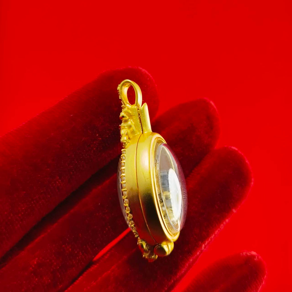 Phra Brahma amulet for protection featuring a gold frame and clear casing for spiritual safety