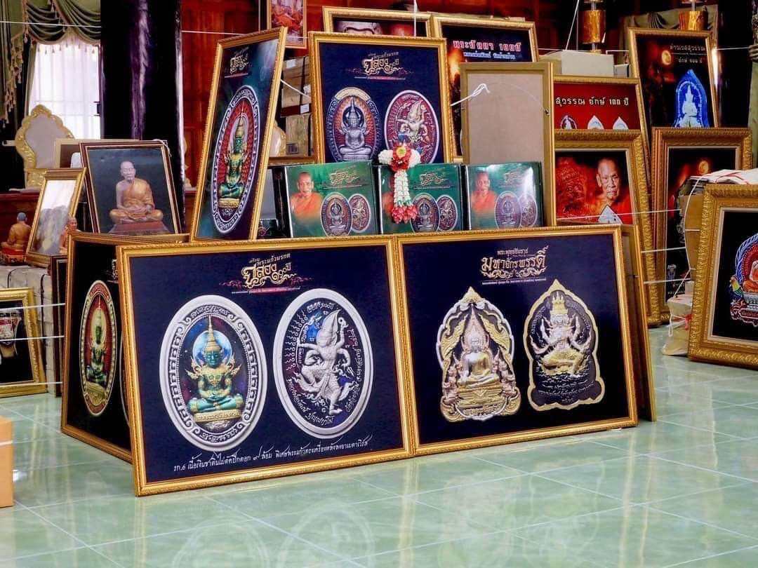 Display of Phra Buddha Chinnarat amulets and sacred pendants by Thai Blessing Co in a shop setting