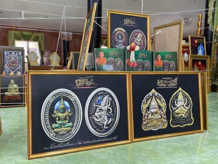 Framed Phra Buddha Chinnarat amulet displays showcasing intricate designs and spiritual significance