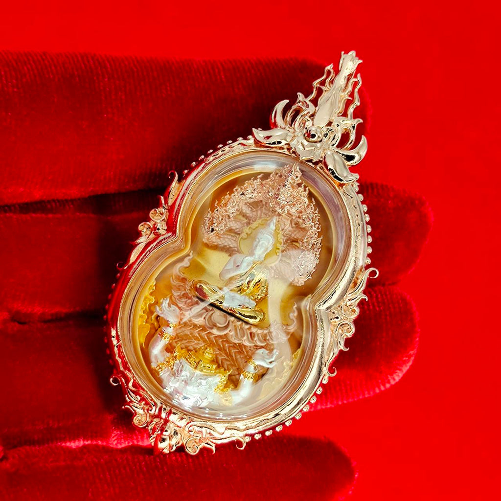 Phra Naga Prok amulet for protection, intricately designed with gold accents and religious symbolism