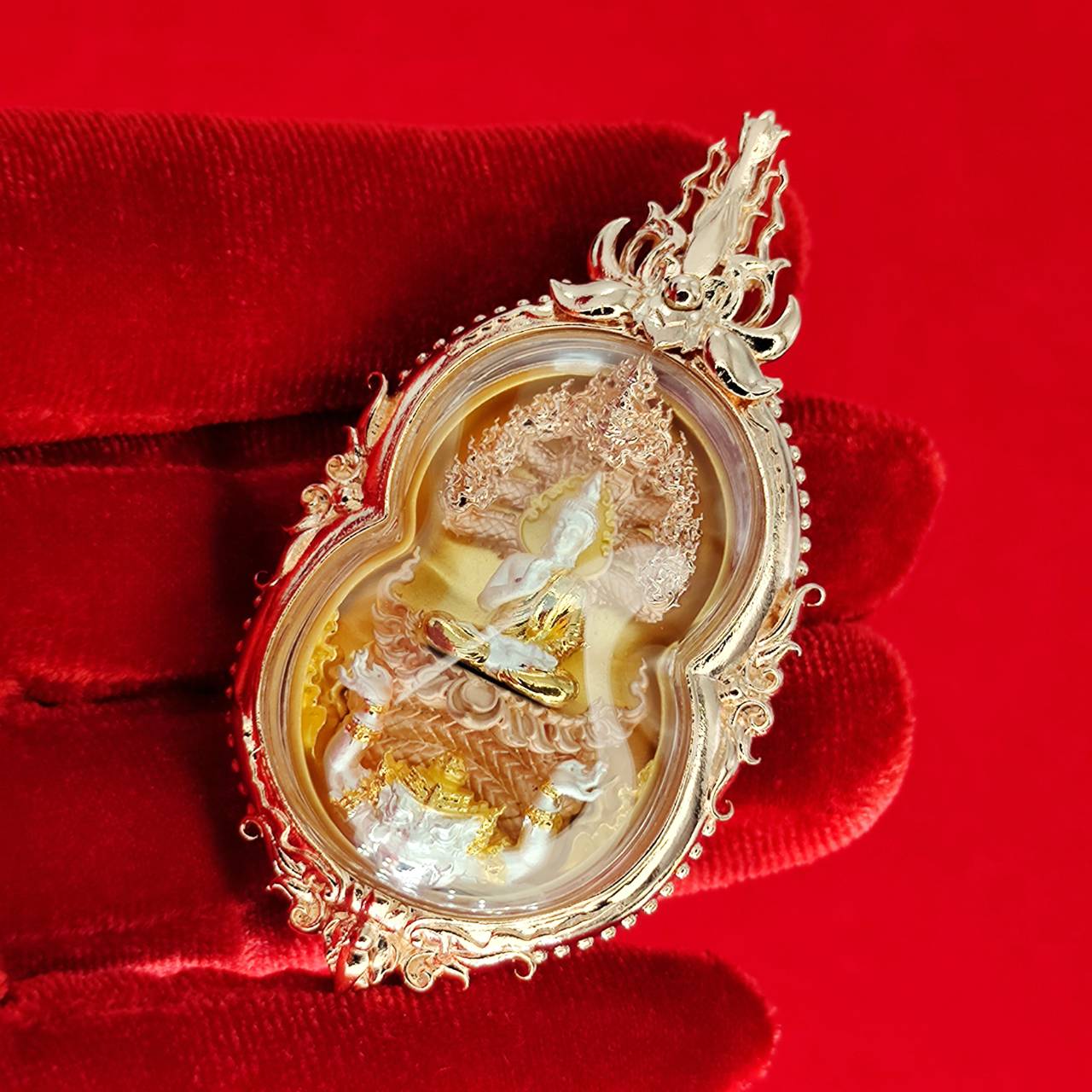 Phra Naga Prok amulet for protection, intricately designed with gold accents and religious symbolism