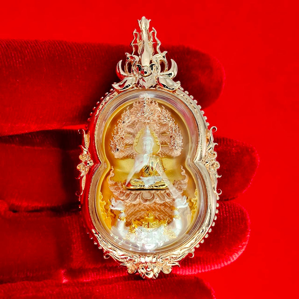 Phra Naga Prok amulet for protection with intricate gold detailing and a serene Buddha figure