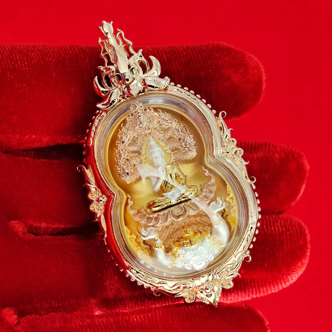 Phra Naga Prok amulet for protection in ornate gold setting showcasing intricate craftsmanship