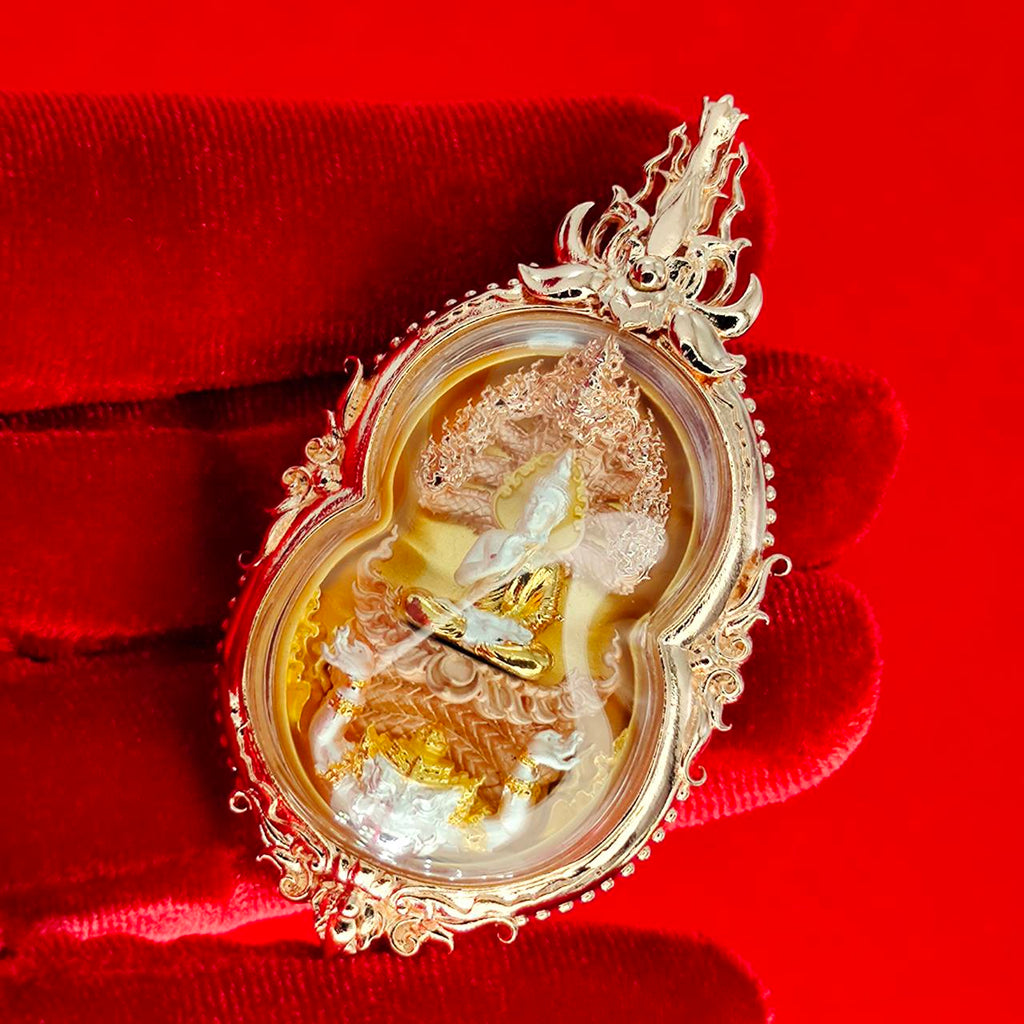 Phra Naga Prok amulet for protection in ornate gold casing with intricate details and a spiritual design