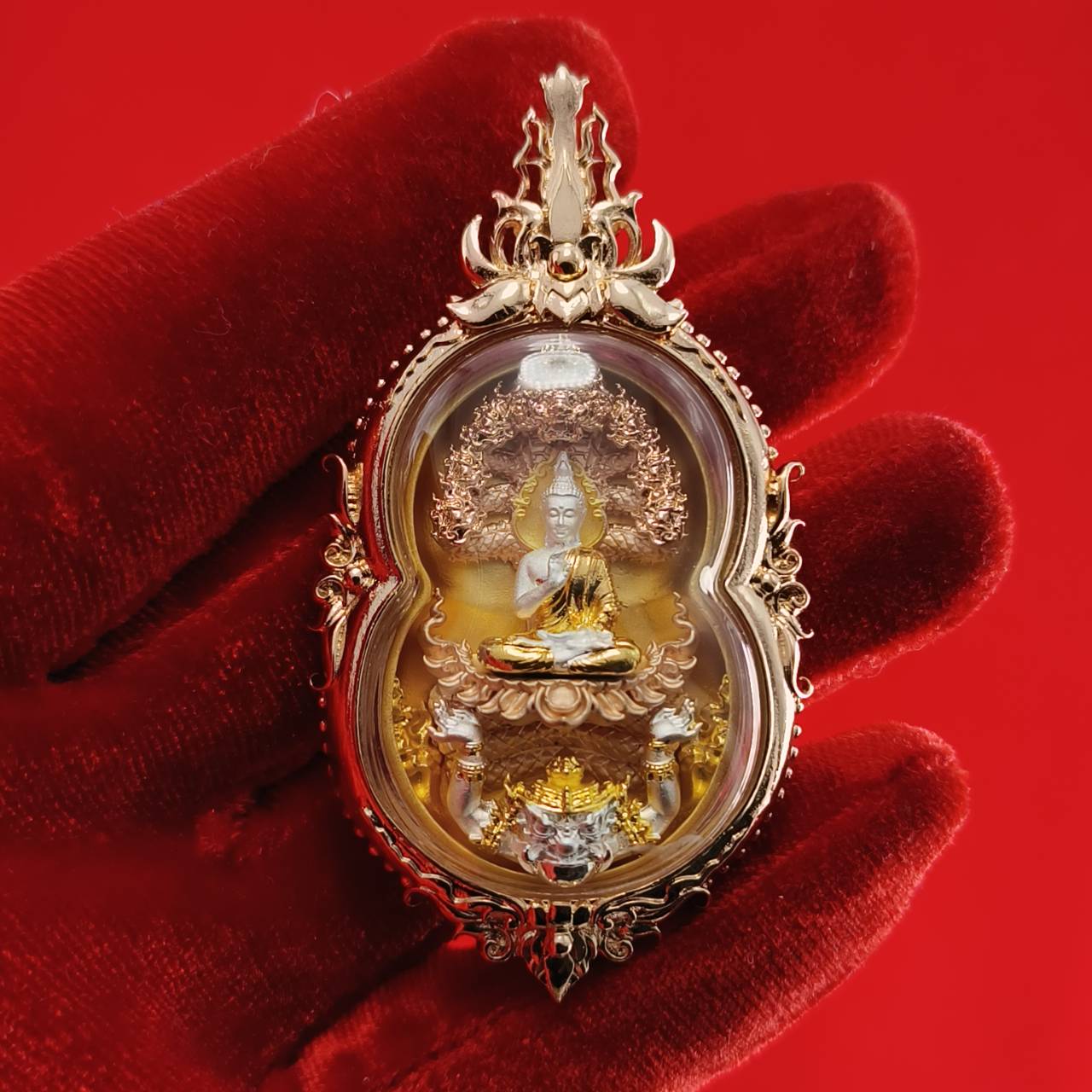 Phra Naga Prok amulet for protection with intricate details and a gold finish, ideal for spiritual decor