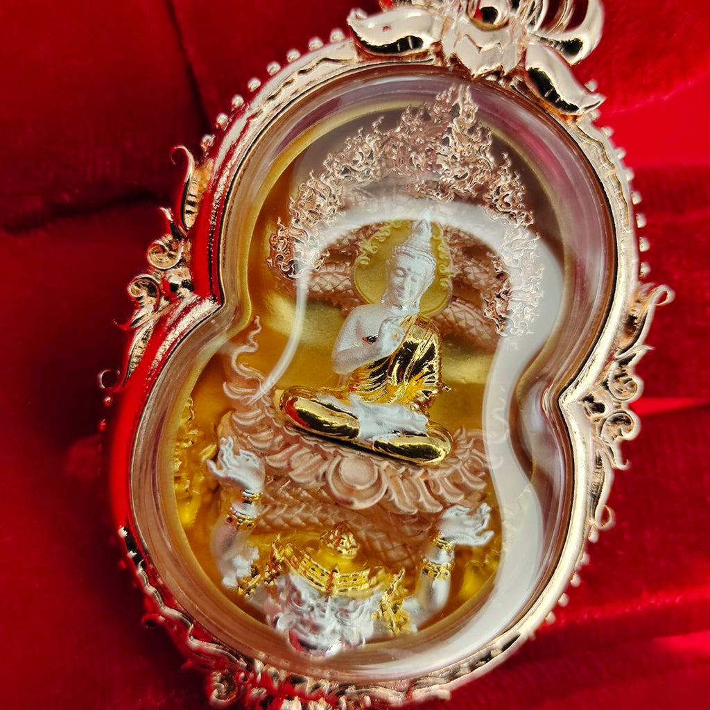 Intricate Phra Naga Prok amulet for protection featuring a seated Buddha and ornate detailing