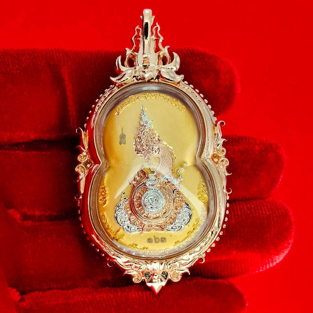 Phra Naga Prok amulet for protection in ornate gold casing with intricate design and vivid details
