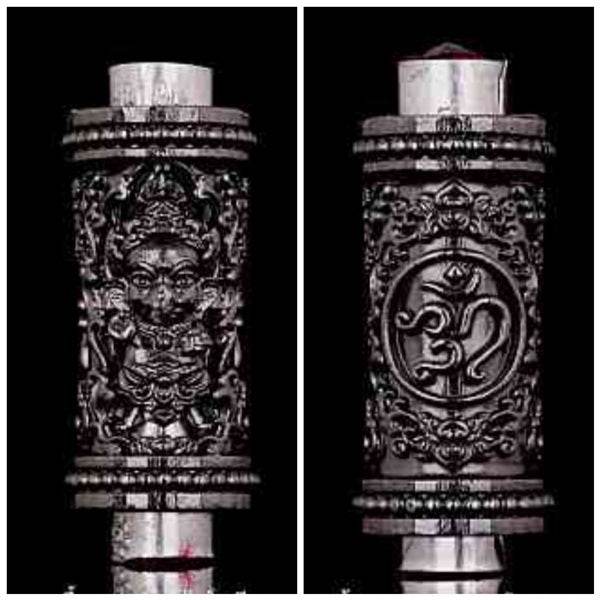 Phra Phikanet Takrud amulet carved in intricate detail with protective symbols and designs
