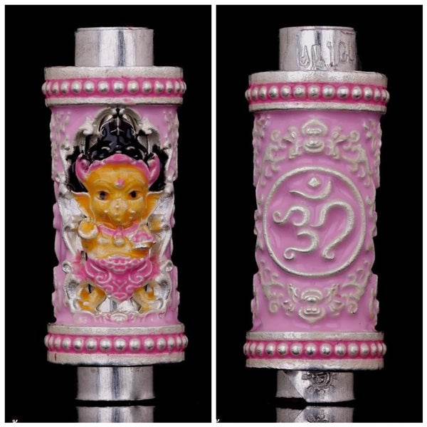 Phra Phikanet Takrud amulet with intricate design and vibrant colors, featuring detailed figurine and motifs