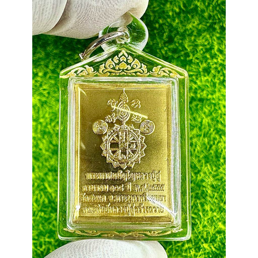 Phra Phrom amulet for sale in clear protective case with gold detailed design held by hand