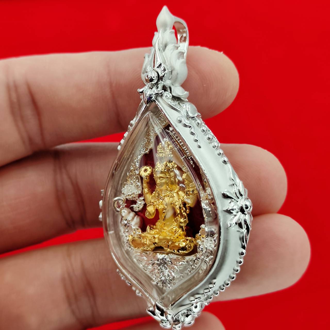 Phra Phrom amulet Supreme Divine Blessings & Prosperity in a decorative silver casing for spiritual protection