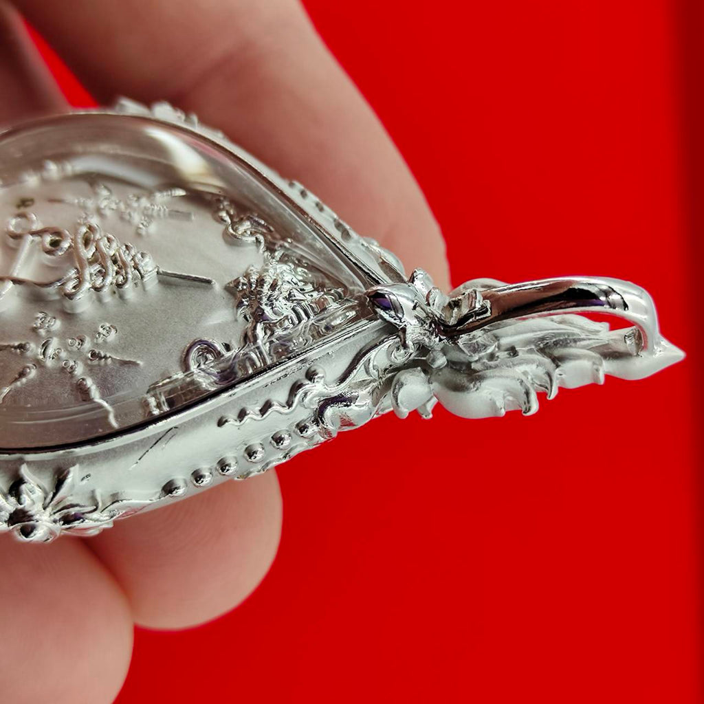 Close-up of Phra Phrom amulet for Supreme Divine Blessings & Prosperity, showcasing intricate details and craftsmanship