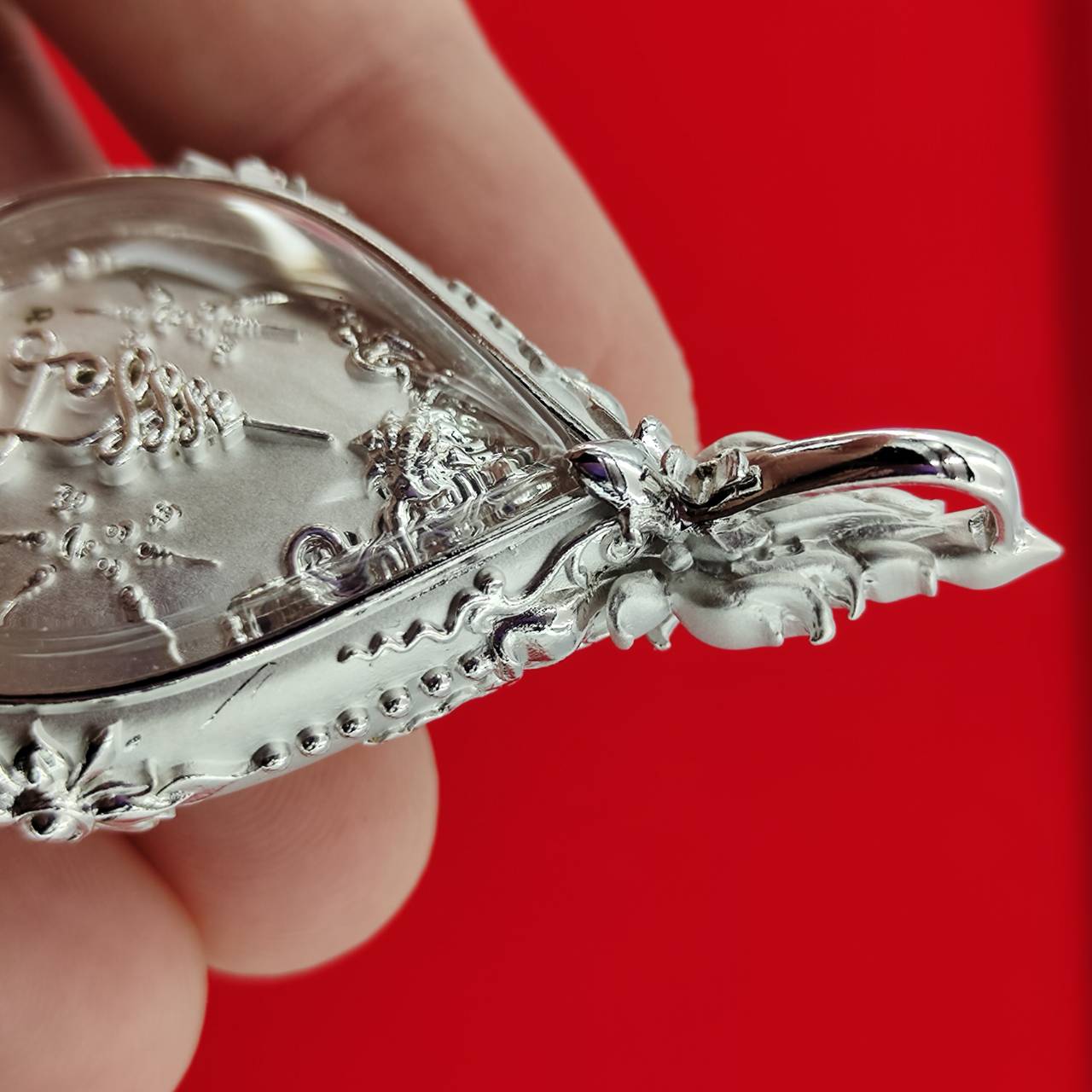 Close-up of Phra Phrom amulet for Supreme Divine Blessings & Prosperity, showcasing intricate details and craftsmanship
