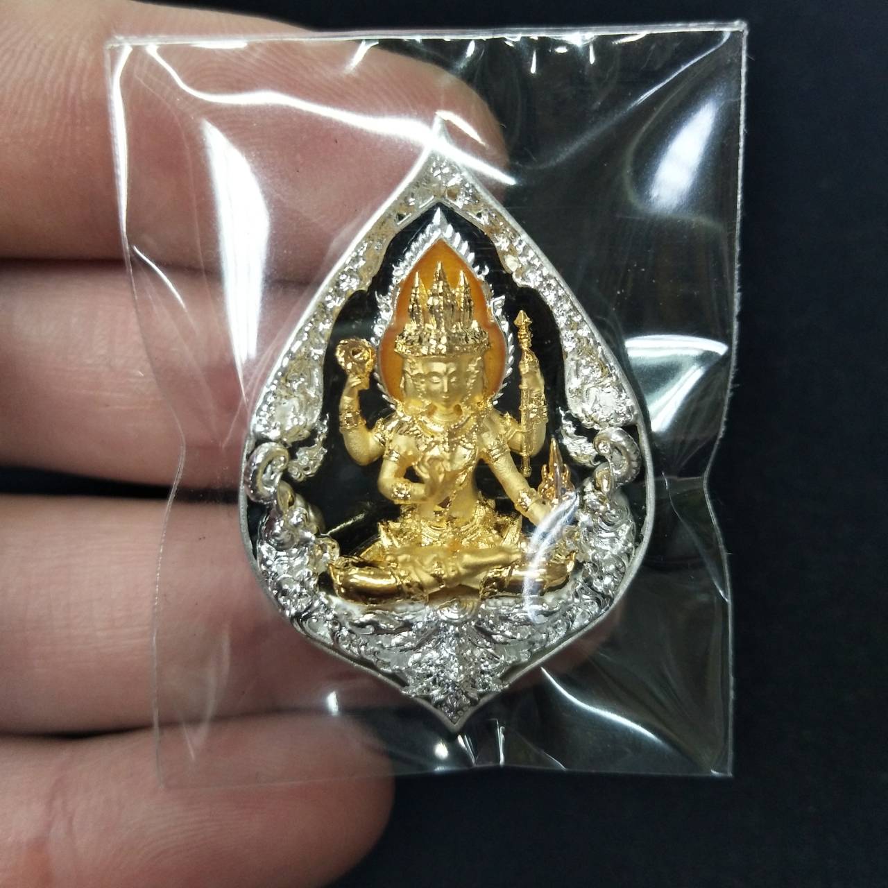 Phra Phrom elephant guardian amulet in a teardrop design, showcasing intricate gold detailing