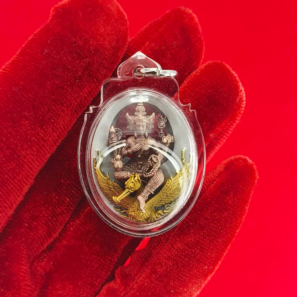 Phra Phrom Thai amulet in ornate casing featuring intricate gold and metallic details for spiritual decor
