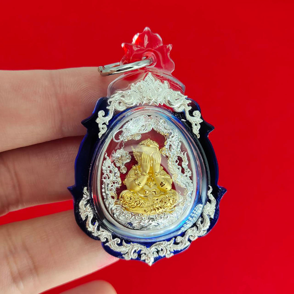 Phra Pidta amulet for wealth in a decorative casing, ideal for enhancing prosperity and luck