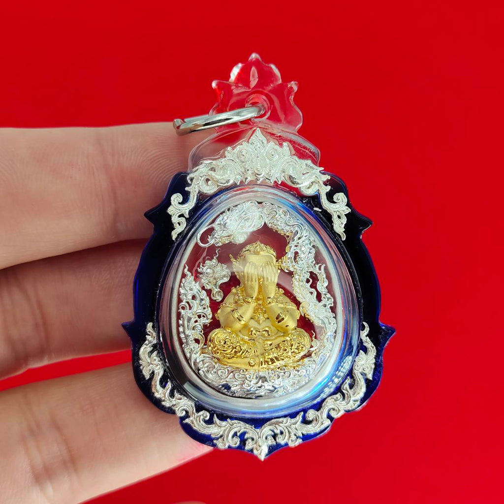 Phra Pidta amulet for wealth in ornate casing, designed for prosperity and good fortune