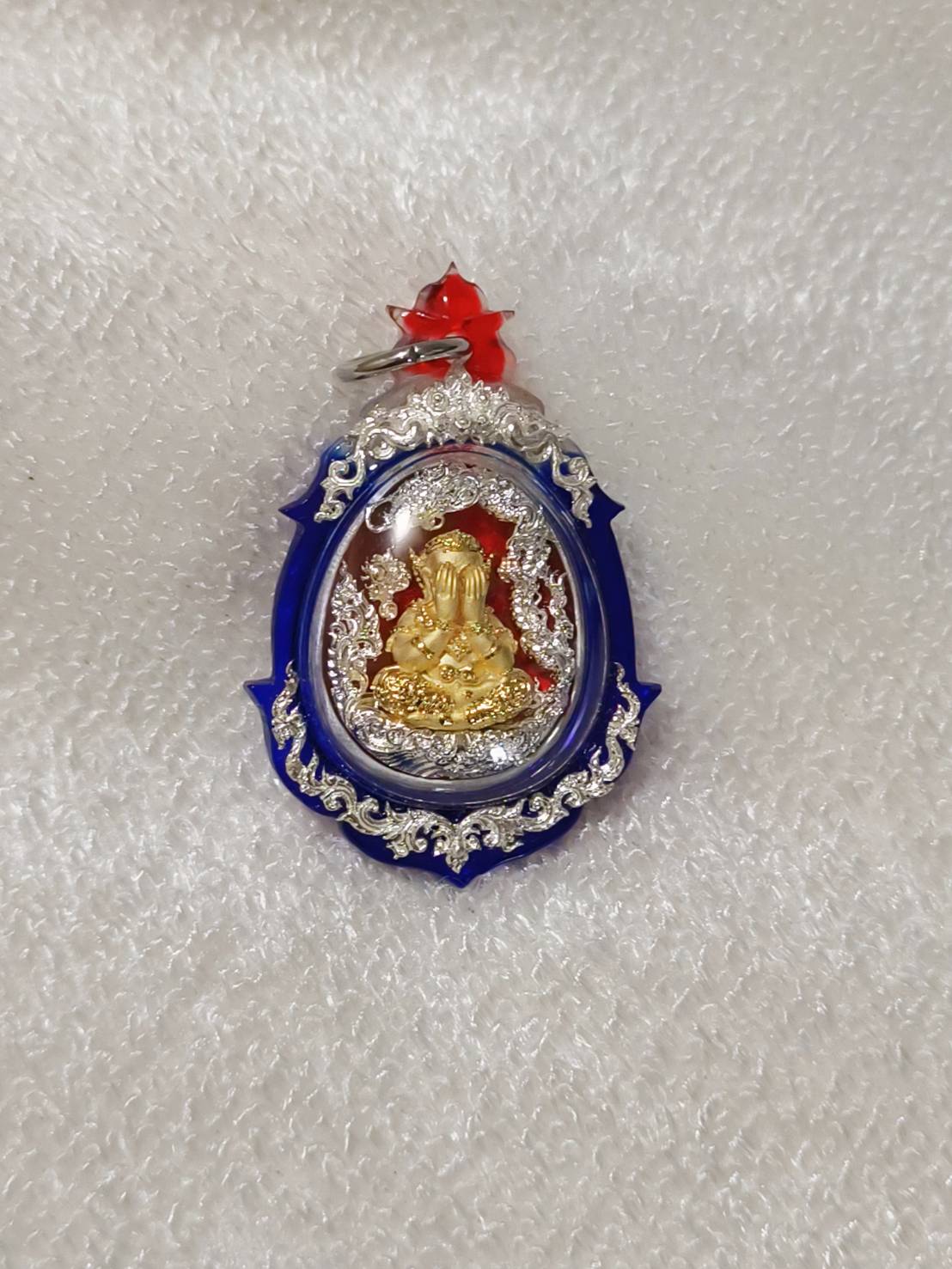 Phra Pidta amulet for wealth in a decorative frame, ideal for attracting prosperity and fortune