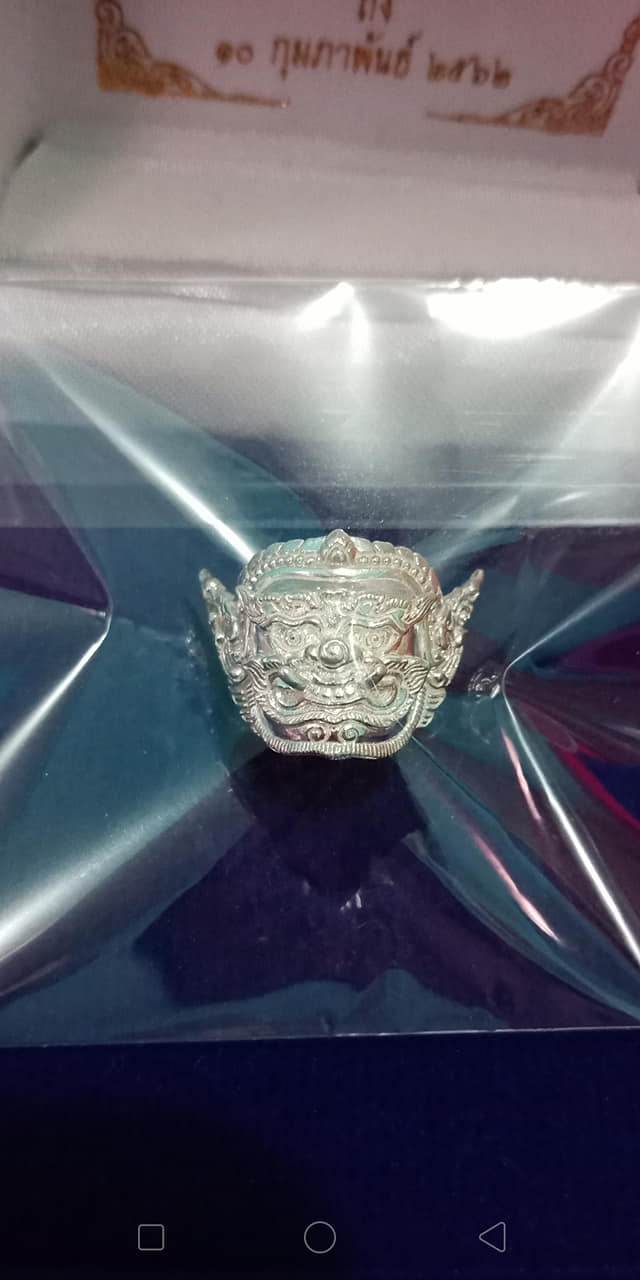 Silver Phra Pirap amulet for power displayed in protective packaging, representing spiritual strength