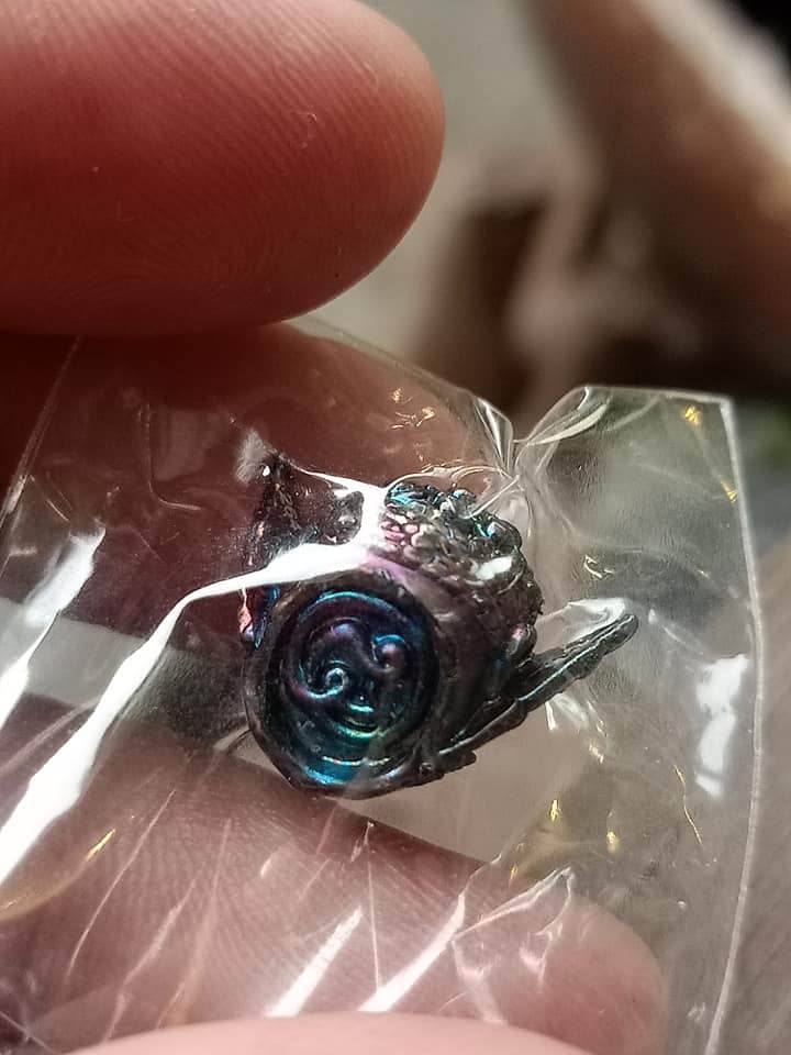 Phra Pirap amulet for power in a protective plastic packaging, showcasing intricate details