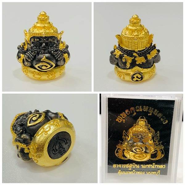 Phra Rahu amulet for luck featuring intricate gold and black detailing and mystical symbols