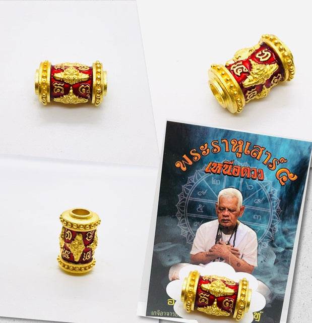 Phra Rahu amulet for luck featuring intricate designs in gold and red, perfect for attracting positive energy
