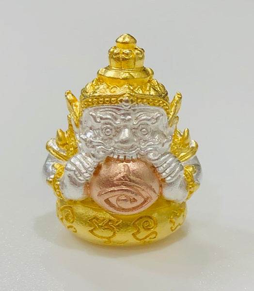 Gold and silver Phra Rahu amulet for luck featuring intricate design and detailed craftsmanship