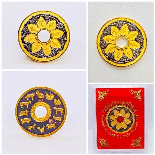 Phra Rahu amulet for protection featuring intricate gold and black designs with a floral motif