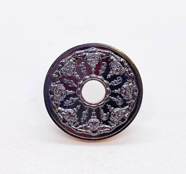Phra Rahu amulet for protection with intricate silver detailing and central hole design