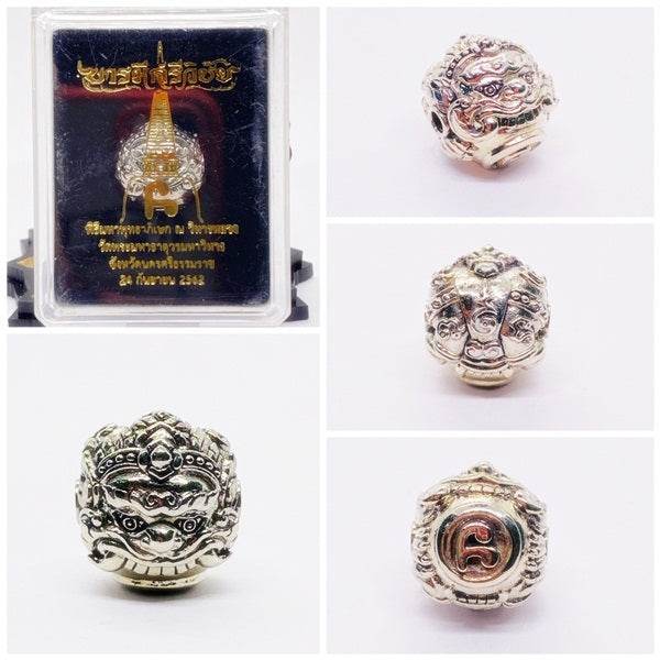 Phra Rahu Nomo Sriwichai amulet for luck displayed in a decorative box, showcasing intricate details