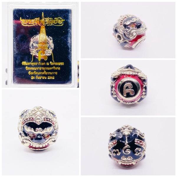 Phra Rahu Nomo Sriwichai amulet for luck in decorative packaging showcasing intricate designs