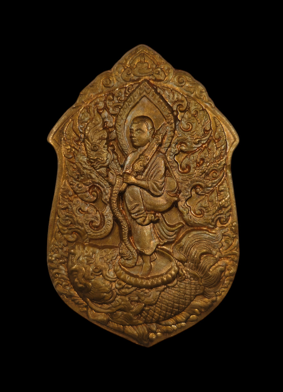 Intricately carved Phra Siwali amulet for wealth with detailed design on bronze-colored metal